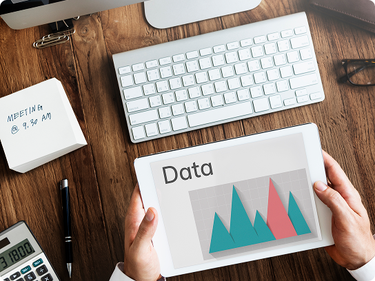 image of a keyboard and a data diagram on paper