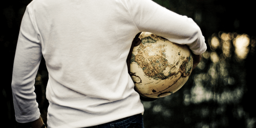 person with a globus in hand